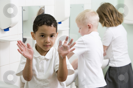 To use this stock image in your creative project, please select the size you need over to the right and click the "Add to Cart" button.
Your downloaded image will come with the Cutcaster watermark removed so don’t worry about the watermark you see on this page. A boy displaying his hands in a primary school bathroom stock photo, by Monkey Business Images