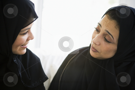 To use this stock image in your creative project, please select the size you need over to the right and click the "Add to Cart" button.
Your downloaded image will come with the Cutcaster watermark removed so don’t worry about the watermark you see on this page. Two Middle Eastern women talking together stock photo, by Monkey Business Images