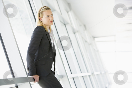 To use this stock image in your creative project, please select the size you need over to the right and click the "Add to Cart" button.
Your downloaded image will come with the Cutcaster watermark removed so don’t worry about the watermark you see on this page. Businesswoman standing in corridor stock photo, by Monkey Business Images