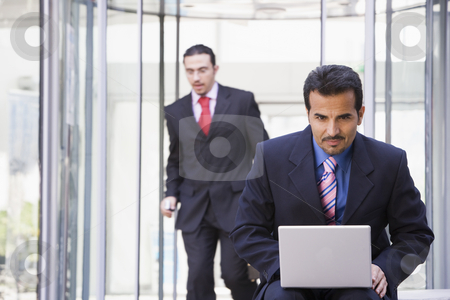 To use this stock image in your creative project, please select the size you need over to the right and click the "Add to Cart" button.
Your downloaded image will come with the Cutcaster watermark removed so don’t worry about the watermark you see on this page. Businessman working at laptop outside stock photo, Businessman working at laptop outside by Monkey Business Images