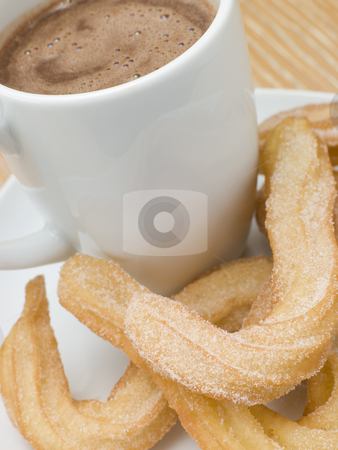 To use this stock image in your creative project, please select the size you need over to the right and click the "Add to Cart" button.
Your downloaded image will come with the Cutcaster watermark removed so don’t worry about the watermark you see on this page. Churros and Hot Chocolate stock photo, by Monkey Business Images