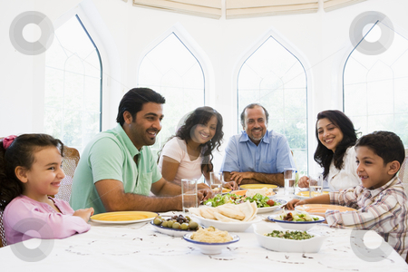 To use this stock image in your creative project, please select the size you need over to the right and click the "Add to Cart" button.
Your downloaded image will come with the Cutcaster watermark removed so don’t worry about the watermark you see on this page. A Middle Eastern family enjoying a meal together stock photo, by Monkey Business Images