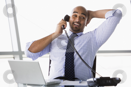 To use this stock image in your creative project, please select the size you need over to the right and click the "Add to Cart" button.
Your downloaded image will come with the Cutcaster watermark removed so don’t worry about the watermark you see on this page. Businessman taking phone call stock photo, Businessman taking call in office by Monkey Business Images
