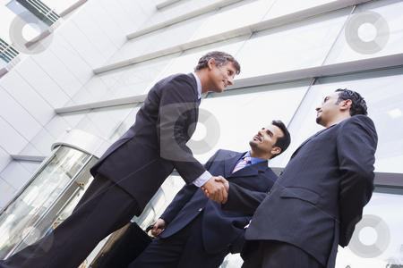 To use this stock image in your creative project, please select the size you need over to the right and click the "Add to Cart" button.
Your downloaded image will come with the Cutcaster watermark removed so don’t worry about the watermark you see on this page. Group of businessmen shaking hands outside office stock photo, Group of businessmen shaking hands outside modern office by Monkey Business Images