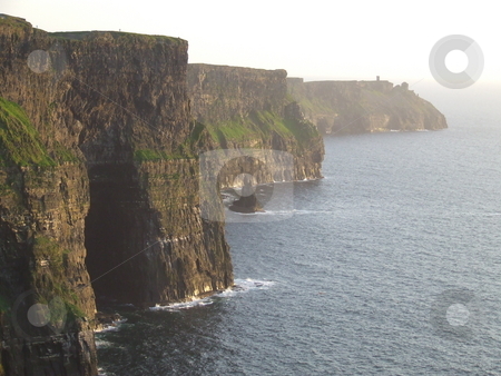 To use this stock image in your creative project, please select the size you need over to the right and click the "Add to Cart" button.
Your downloaded image will come with the Cutcaster watermark removed so don’t worry about the watermark you see on this page. Cliff Shoreline stock photo, Cliffs of Mohar by Paul Lancaster