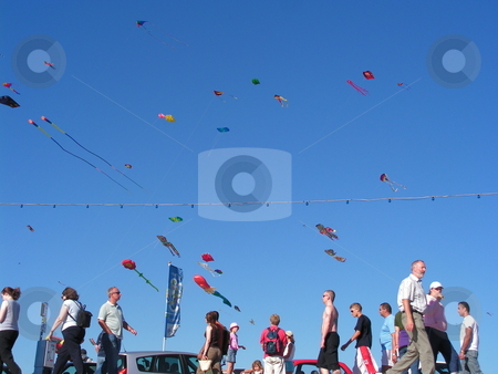 To use this stock image in your creative project, please select the size you need over to the right and click the "Add to Cart" button.
Your downloaded image will come with the Cutcaster watermark removed so don’t worry about the watermark you see on this page. Kite festival stock photo, Kite festival and spectators by Paul Lancaster