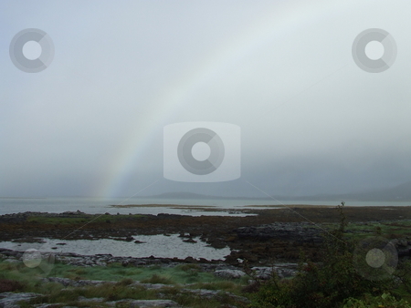 To use this stock image in your creative project, please select the size you need over to the right and click the "Add to Cart" button.
Your downloaded image will come with the Cutcaster watermark removed so don’t worry about the watermark you see on this page. Rainbow over Galway Bay stock photo, Rainbow over Galway Bay by Paul Lancaster