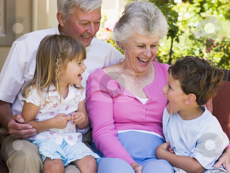 To use this stock image in your creative project, please select the size you need over to the right and click the "Add to Cart" button.
Your downloaded image will come with the Cutcaster watermark removed so don’t worry about the watermark you see on this page. Grandparents laughing with grandchildren stock photo, by Monkey Business Images