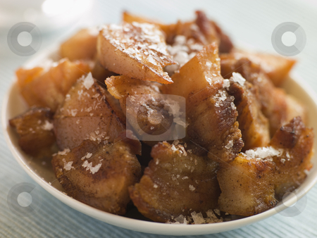 To use this stock image in your creative project, please select the size you need over to the right and click the "Add to Cart" button.
Your downloaded image will come with the Cutcaster watermark removed so don’t worry about the watermark you see on this page. Dish of Chicharrones with Sea Salt Flakes stock photo, by Monkey Business Images