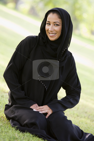 To use this stock image in your creative project, please select the size you need over to the right and click the "Add to Cart" button.
Your downloaded image will come with the Cutcaster watermark removed so don’t worry about the watermark you see on this page. A Middle Eastern woman sitting in a park stock photo, by Monkey Business Images
