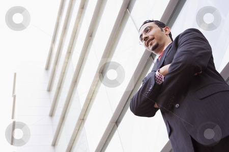 To use this stock image in your creative project, please select the size you need over to the right and click the "Add to Cart" button.
Your downloaded image will come with the Cutcaster watermark removed so don’t worry about the watermark you see on this page. Businessman standing outstanding office stock photo, Businessman standing outside modern office building by Monkey Business Images