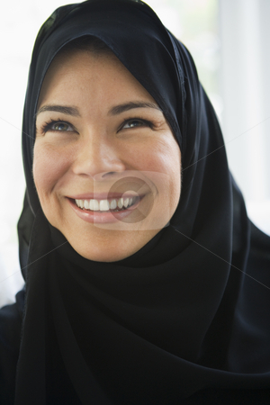 To use this stock image in your creative project, please select the size you need over to the right and click the "Add to Cart" button.
Your downloaded image will come with the Cutcaster watermark removed so don’t worry about the watermark you see on this page. Portrait of a middle eastern woman wearing a black hijab stock photo, by Monkey Business Images
