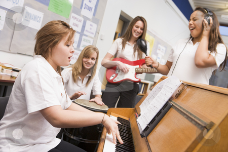 To use this stock image in your creative project, please select the size you need over to the right and click the "Add to Cart" button.
Your downloaded image will come with the Cutcaster watermark removed so don’t worry about the watermark you see on this page. Schoolgirls playing musical instruments in music class stock photo, by Monkey Business Images