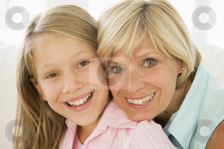 To use this stock image in your creative project, please select the size you need over to the right and click the "Add to Cart" button.
Your downloaded image will come with the Cutcaster watermark removed so don’t worry about the watermark you see on this page. Grandmother and granddaughter smiling stock photo, by Monkey Business Images