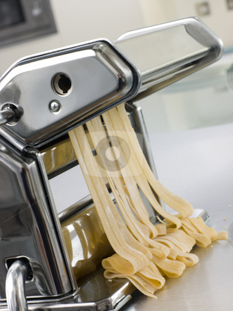 To use this stock image in your creative project, please select the size you need over to the right and click the "Add to Cart" button.
Your downloaded image will come with the Cutcaster watermark removed so don’t worry about the watermark you see on this page. Fresh Egg Tagliatelle Being rolled in a Pasta Machine stock photo, Close up image of Fresh Egg Tagliatelle Being rolled in a Pasta Machine by Monkey Business Images