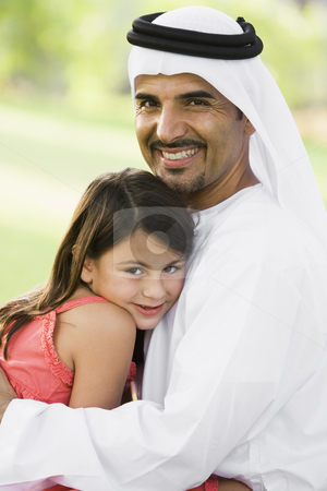 To use this stock image in your creative project, please select the size you need over to the right and click the "Add to Cart" button.
Your downloaded image will come with the Cutcaster watermark removed so don’t worry about the watermark you see on this page. A Middle Eastern man and his daughter sitting in a park stock photo, by Monkey Business Images
