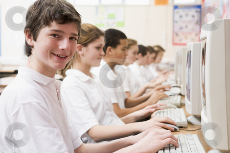To use this stock image in your creative project, please select the size you need over to the right and click the "Add to Cart" button.
Your downloaded image will come with the Cutcaster watermark removed so don’t worry about the watermark you see on this page. Row of schoolchildren studying in front of a computer stock photo, by Monkey Business Images