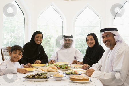 To use this stock image in your creative project, please select the size you need over to the right and click the "Add to Cart" button.
Your downloaded image will come with the Cutcaster watermark removed so don’t worry about the watermark you see on this page. A Middle Eastern family enjoying a meal stock photo, by Monkey Business Images