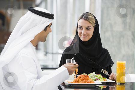To use this stock image in your creative project, please select the size you need over to the right and click the "Add to Cart" button.
Your downloaded image will come with the Cutcaster watermark removed so don’t worry about the watermark you see on this page. A Middle Eastern couple enjoying a meal in a restaurant stock photo, by Monkey Business Images