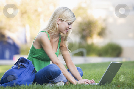 To use this stock image in your creative project, please select the size you need over to the right and click the "Add to Cart" button.
Your downloaded image will come with the Cutcaster watermark removed so don’t worry about the watermark you see on this page. University student using laptop outside stock photo, Female university student using laptop outside by Monkey Business Images