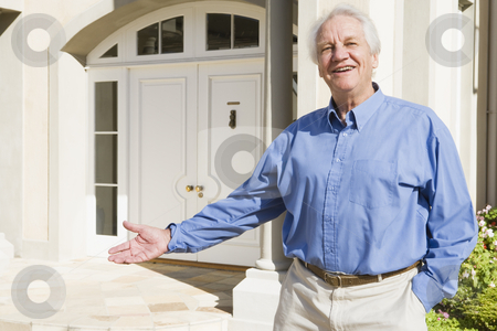 To use this stock image in your creative project, please select the size you need over to the right and click the "Add to Cart" button.
Your downloaded image will come with the Cutcaster watermark removed so don’t worry about the watermark you see on this page. Senior man standing outside house stock photo, Senior man welcoming visitor to home by Monkey Business Images