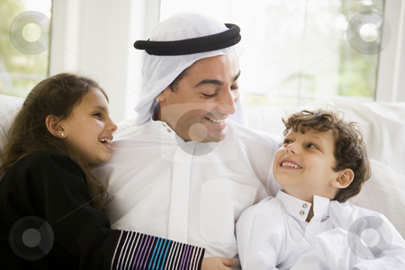 To use this stock image in your creative project, please select the size you need over to the right and click the "Add to Cart" button.
Your downloaded image will come with the Cutcaster watermark removed so don’t worry about the watermark you see on this page. A Middle Eastern man with his children stock photo, by Monkey Business Images