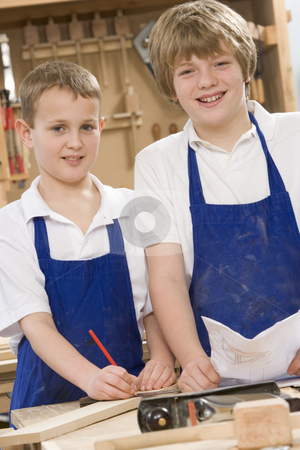 To use this stock image in your creative project, please select the size you need over to the right and click the "Add to Cart" button.
Your downloaded image will come with the Cutcaster watermark removed so don’t worry about the watermark you see on this page. Schoolboys in woodwork class stock photo, by Monkey Business Images