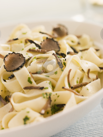 To use this stock image in your creative project, please select the size you need over to the right and click the "Add to Cart" button.
Your downloaded image will come with the Cutcaster watermark removed so don’t worry about the watermark you see on this page. Tagaliatelli with Sliced Black Truffles stock photo, by Monkey Business Images