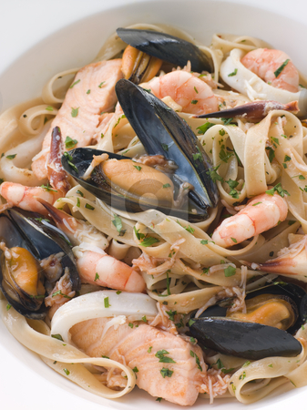 To use this stock image in your creative project, please select the size you need over to the right and click the "Add to Cart" button.
Your downloaded image will come with the Cutcaster watermark removed so don’t worry about the watermark you see on this page. Bowl of Seafood Tagliatelle stock photo, by Monkey Business Images