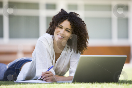 To use this stock image in your creative project, please select the size you need over to the right and click the "Add to Cart" button.
Your downloaded image will come with the Cutcaster watermark removed so don’t worry about the watermark you see on this page. Woman using laptop on campus stock photo, by Monkey Business Images