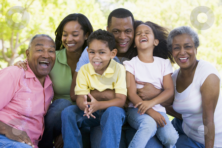 To use this stock image in your creative project, please select the size you need over to the right and click the "Add to Cart" button.
Your downloaded image will come with the Cutcaster watermark removed so don’t worry about the watermark you see on this page. Extended family sitting outdoors smiling stock photo, by Monkey Business Images