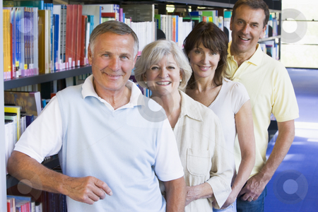 To use this stock image in your creative project, please select the size you need over to the right and click the "Add to Cart" button.
Your downloaded image will come with the Cutcaster watermark removed so don’t worry about the watermark you see on this page. Adult students standing in a library stock photo, by Monkey Business Images