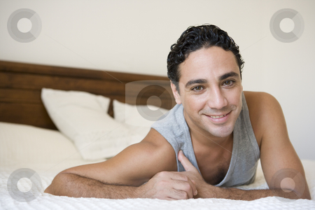 To use this stock image in your creative project, please select the size you need over to the right and click the "Add to Cart" button.
Your downloaded image will come with the Cutcaster watermark removed so don’t worry about the watermark you see on this page. A Middle Eastern man lying on a bed stock photo, by Monkey Business Images