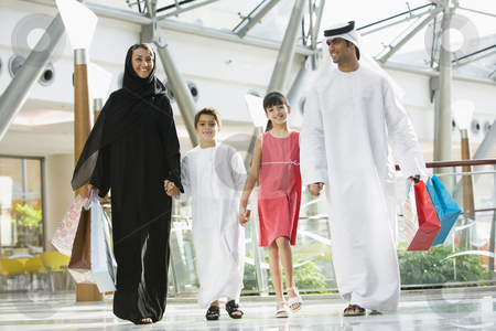 To use this stock image in your creative project, please select the size you need over to the right and click the "Add to Cart" button.
Your downloaded image will come with the Cutcaster watermark removed so don’t worry about the watermark you see on this page. A Middle Eastern family in a shopping mall stock photo, by Monkey Business Images