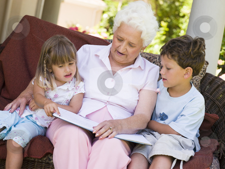 To use this stock image in your creative project, please select the size you need over to the right and click the "Add to Cart" button.
Your downloaded image will come with the Cutcaster watermark removed so don’t worry about the watermark you see on this page. Grandmother reading to grandchildren stock photo, by Monkey Business Images