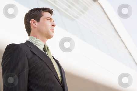 To use this stock image in your creative project, please select the size you need over to the right and click the "Add to Cart" button.
Your downloaded image will come with the Cutcaster watermark removed so don’t worry about the watermark you see on this page. Businessman standing outdoors by building stock photo, by Monkey Business Images