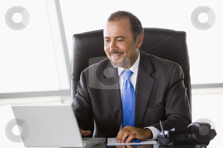To use this stock image in your creative project, please select the size you need over to the right and click the "Add to Cart" button.
Your downloaded image will come with the Cutcaster watermark removed so don’t worry about the watermark you see on this page. Businessman working at desk stock photo, Businessman working at laptop in office by Monkey Business Images