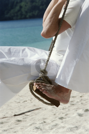 To use this stock image in your creative project, please select the size you need over to the right and click the "Add to Cart" button.
Your downloaded image will come with the Cutcaster watermark removed so don’t worry about the watermark you see on this page. Couple on swing at beach stock photo, by Monkey Business Images