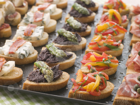 To use this stock image in your creative project, please select the size you need over to the right and click the "Add to Cart" button.
Your downloaded image will come with the Cutcaster watermark removed so don’t worry about the watermark you see on this page. Selection of Crostini stock photo, Platter of Selection of Crostini by Monkey Business Images