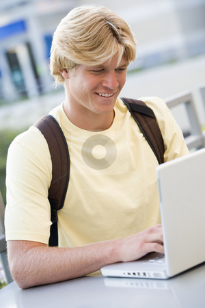 To use this stock image in your creative project, please select the size you need over to the right and click the "Add to Cart" button.
Your downloaded image will come with the Cutcaster watermark removed so don’t worry about the watermark you see on this page. Male student using laptop outside stock photo, Male university student using laptop computer outside by Monkey Business Images