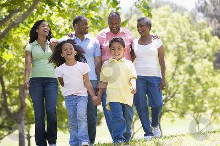 To use this stock image in your creative project, please select the size you need over to the right and click the "Add to Cart" button.
Your downloaded image will come with the Cutcaster watermark removed so don’t worry about the watermark you see on this page. Extended family walking in park holding hands and smiling stock photo, by Monkey Business Images
