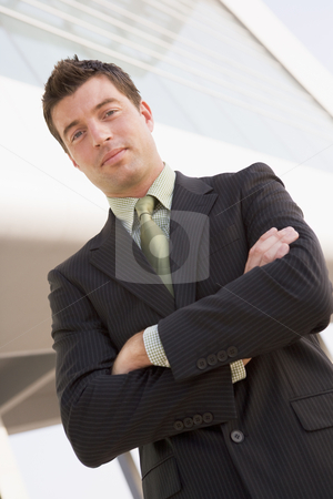 To use this stock image in your creative project, please select the size you need over to the right and click the "Add to Cart" button.
Your downloaded image will come with the Cutcaster watermark removed so don’t worry about the watermark you see on this page. Businessman standing outdoors by building stock photo, by Monkey Business Images