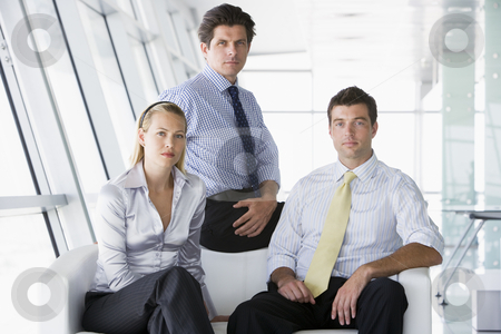 To use this stock image in your creative project, please select the size you need over to the right and click the "Add to Cart" button.
Your downloaded image will come with the Cutcaster watermark removed so don’t worry about the watermark you see on this page. Three businesspeople sitting in office lobby stock photo, by Monkey Business Images
