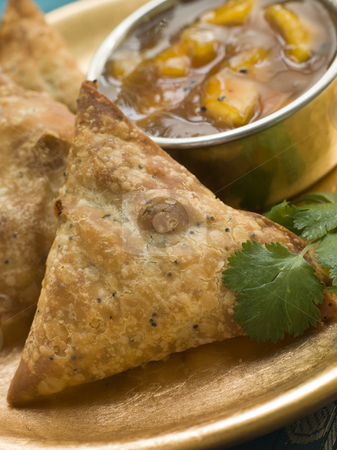 To use this stock image in your creative project, please select the size you need over to the right and click the "Add to Cart" button.
Your downloaded image will come with the Cutcaster watermark removed so don’t worry about the watermark you see on this page. Vegetable Samosa with Mango Chutney stock photo, Plate of Vegetable Samosa with Mango Chutney by Monkey Business Images