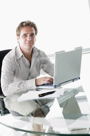 To use this stock image in your creative project, please select the size you need over to the right and click the "Add to Cart" button.
Your downloaded image will come with the Cutcaster watermark removed so don’t worry about the watermark you see on this page. Businessman in boardroom with laptop stock photo, by Monkey Business Images