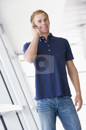 To use this stock image in your creative project, please select the size you need over to the right and click the "Add to Cart" button.
Your downloaded image will come with the Cutcaster watermark removed so don’t worry about the watermark you see on this page. Man standing in corridor wearing headset smiling stock photo, by Monkey Business Images
