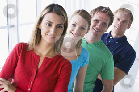 To use this stock image in your creative project, please select the size you need over to the right and click the "Add to Cart" button.
Your downloaded image will come with the Cutcaster watermark removed so don’t worry about the watermark you see on this page. Four people standing in corridor smiling stock photo, by Monkey Business Images
