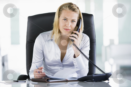To use this stock image in your creative project, please select the size you need over to the right and click the "Add to Cart" button.
Your downloaded image will come with the Cutcaster watermark removed so don’t worry about the watermark you see on this page. Businesswoman in office with personal organizer open on telephon stock photo, by Monkey Business Images