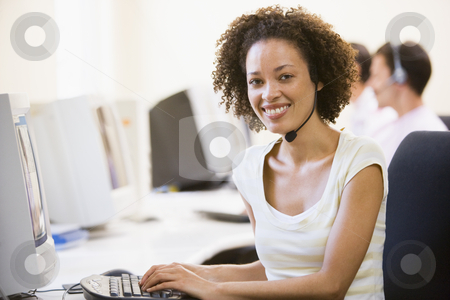To use this stock image in your creative project, please select the size you need over to the right and click the "Add to Cart" button.
Your downloaded image will come with the Cutcaster watermark removed so don’t worry about the watermark you see on this page. Woman wearing headset in computer room smiling stock photo, by Monkey Business Images