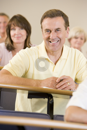 To use this stock image in your creative project, please select the size you need over to the right and click the "Add to Cart" button.
Your downloaded image will come with the Cutcaster watermark removed so don’t worry about the watermark you see on this page. Male adult student listening to a university lecture stock photo, by Monkey Business Images